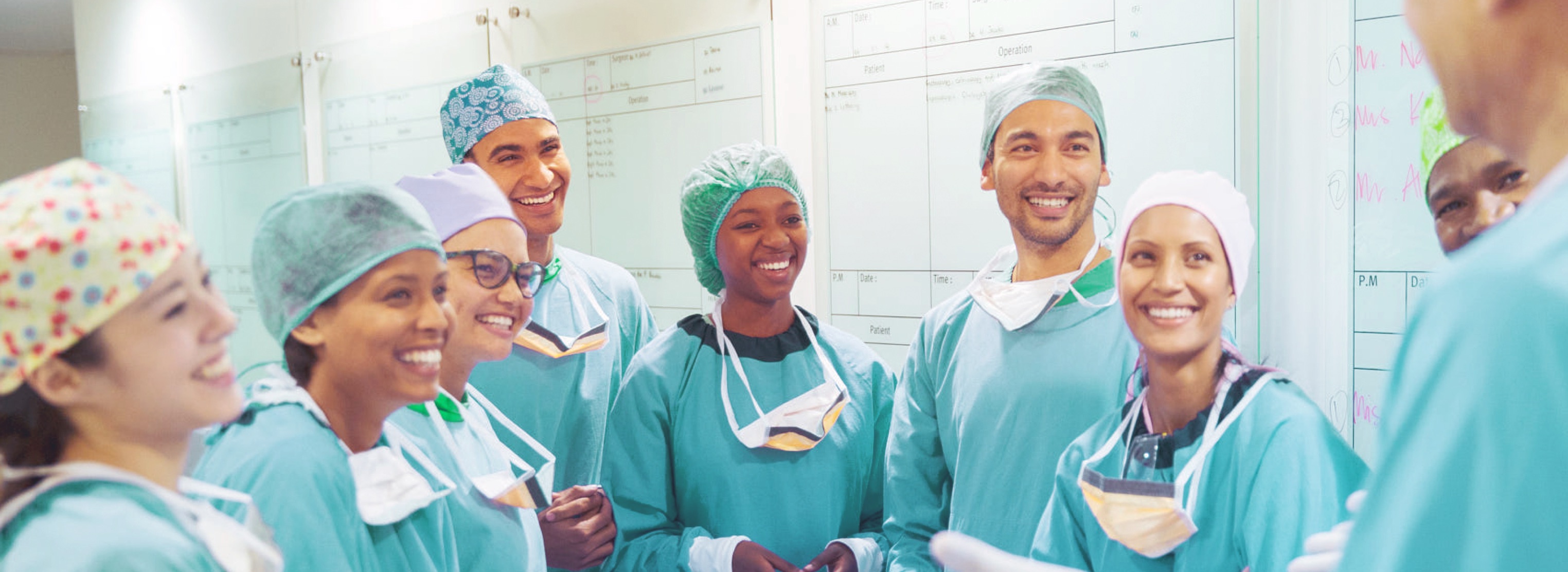 A group of ER doctors smiling happily